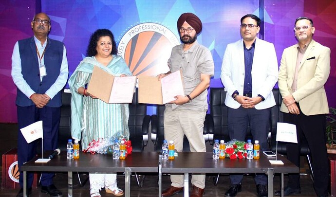 lpu-vice-chancellor-dr-jaspal-singh-sandhu-showing-mou-document-with-sheenam-ohrie-managing-director-broadridge-india
